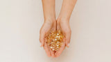 Hands holding Phytality Clean Omega-3 DHA capsules